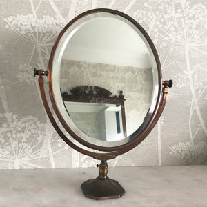 A very pretty Vintage Copper Shop Counter Mirror from an old Leigh on Sea haberdashery shop C.1930. The original mirror plate, that swivels in the frame, is bevelled and has a slight foxing on it. Great patina on the copper. Would look great in the bathroom or on the dressing table - SHOP NOW - www.intovintage.co.uk
