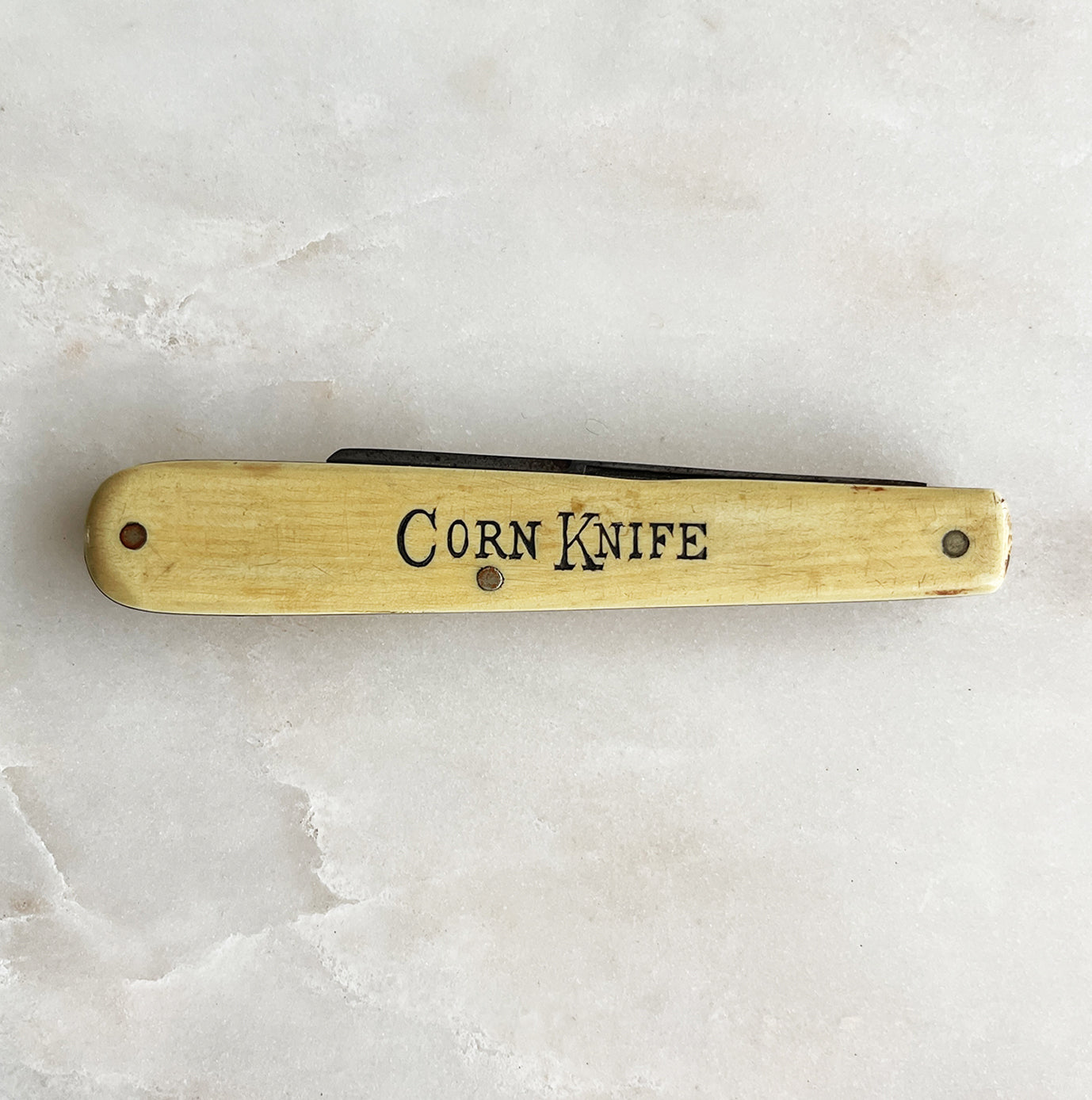 An Antique Waterfall celluloid handle scales, the front is etched CORN KNIFE. High carbon steel spey style blade with long nail pull and finger groove. Brass liners and handle pins. High quality antique pocket knife. Superb condition with a nice patina - SHOP NOW - www.intovintage.co.uk