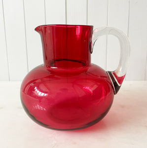 A beautiful Victorian hand blown cranberry glass water jug and glass set, comprising a rounded shaped jug with clear glass handle and four fine tumblers of tapering form. All in excellent condition - SHOP NOW - www.intovintage.co.uk