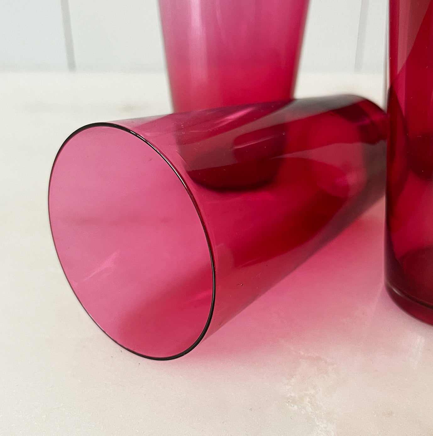 A beautiful Victorian hand blown cranberry glass water jug and glass set, comprising a rounded shaped jug with clear glass handle and four fine tumblers of tapering form. All in excellent condition - SHOP NOW - www.intovintage.co.uk