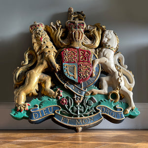 A magnificent, large cast Royal Coat of Arms centred by a crown with lion surmounted and flanked by the lion and unicorn supporting the shield. With foliate surrounded ribbon raised and carrying the motto of the monarch of the United Kingdom, 'Dieu et mon droit' meaning 'God and my right' - SHOP NOW - www.intovintage.co.uk