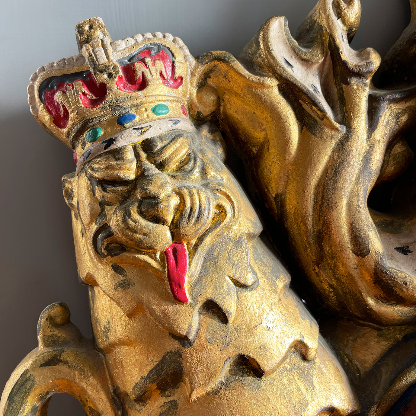 A magnificent, large cast Royal Coat of Arms centred by a crown with lion surmounted and flanked by the lion and unicorn supporting the shield. With foliate surrounded ribbon raised and carrying the motto of the monarch of the United Kingdom, 'Dieu et mon droit' meaning 'God and my right' - SHOP NOW - www.intovintage.co.uk