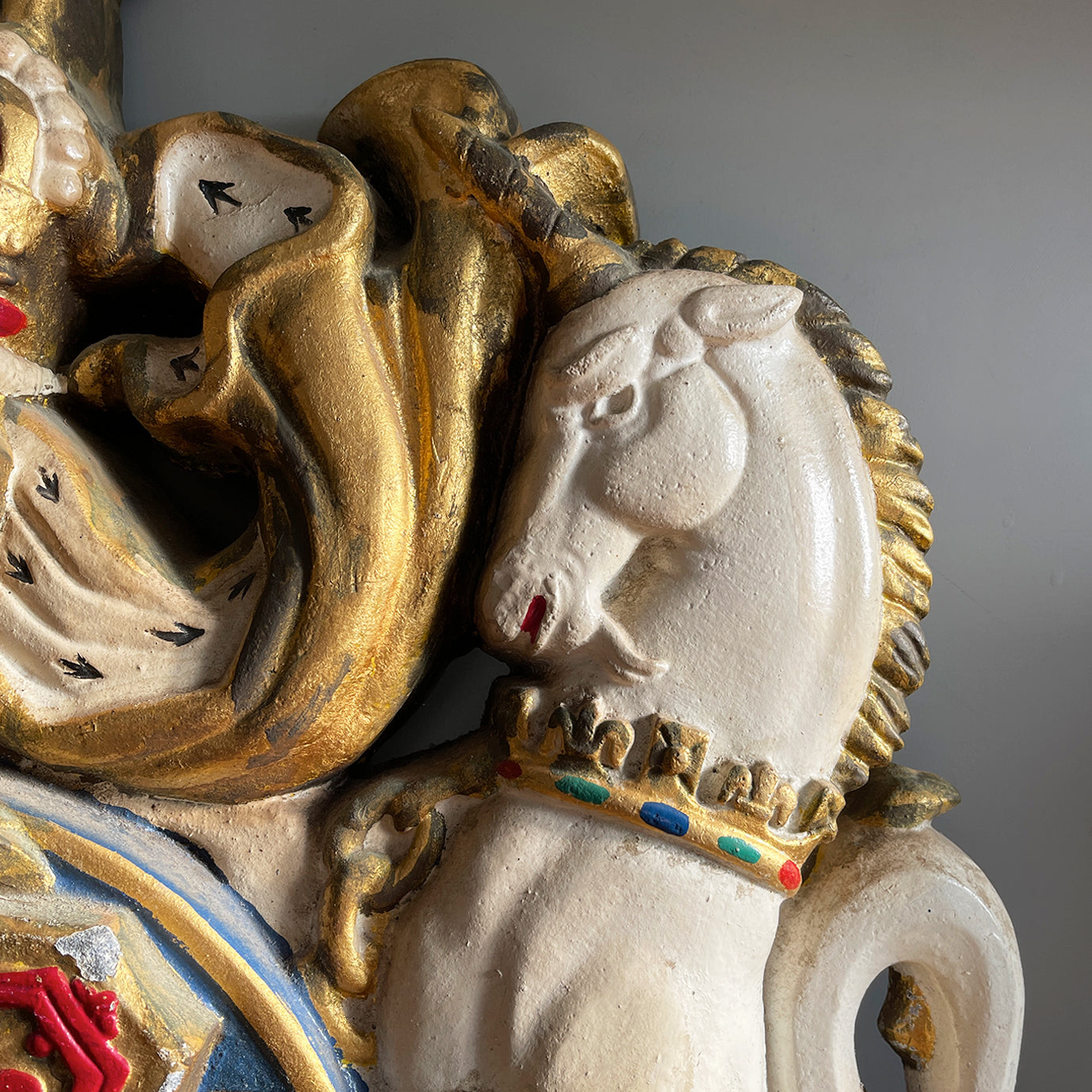 A magnificent, large cast Royal Coat of Arms centred by a crown with lion surmounted and flanked by the lion and unicorn supporting the shield. With foliate surrounded ribbon raised and carrying the motto of the monarch of the United Kingdom, 'Dieu et mon droit' meaning 'God and my right' - SHOP NOW - www.intovintage.co.uk