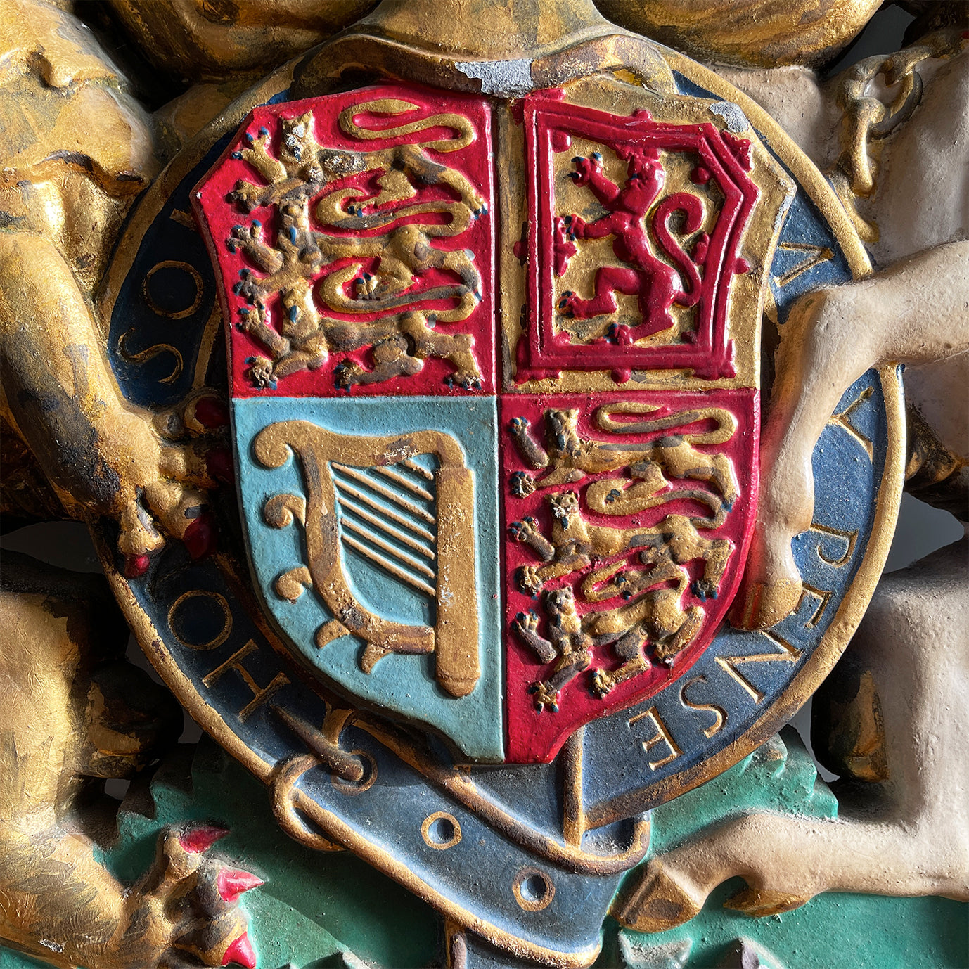 A magnificent, large cast Royal Coat of Arms centred by a crown with lion surmounted and flanked by the lion and unicorn supporting the shield. With foliate surrounded ribbon raised and carrying the motto of the monarch of the United Kingdom, 'Dieu et mon droit' meaning 'God and my right' - SHOP NOW - www.intovintage.co.uk