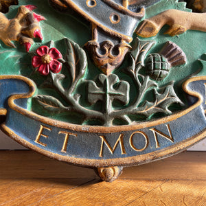 A magnificent, large cast Royal Coat of Arms centred by a crown with lion surmounted and flanked by the lion and unicorn supporting the shield. With foliate surrounded ribbon raised and carrying the motto of the monarch of the United Kingdom, 'Dieu et mon droit' meaning 'God and my right' - SHOP NOW - www.intovintage.co.uk