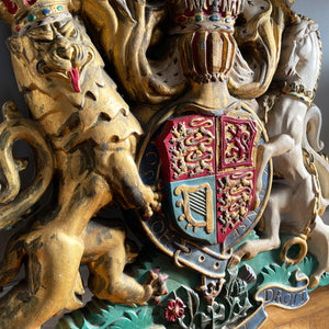 A magnificent, large cast Royal Coat of Arms centred by a crown with lion surmounted and flanked by the lion and unicorn supporting the shield. With foliate surrounded ribbon raised and carrying the motto of the monarch of the United Kingdom, 'Dieu et mon droit' meaning 'God and my right' - SHOP NOW - www.intovintage.co.uk