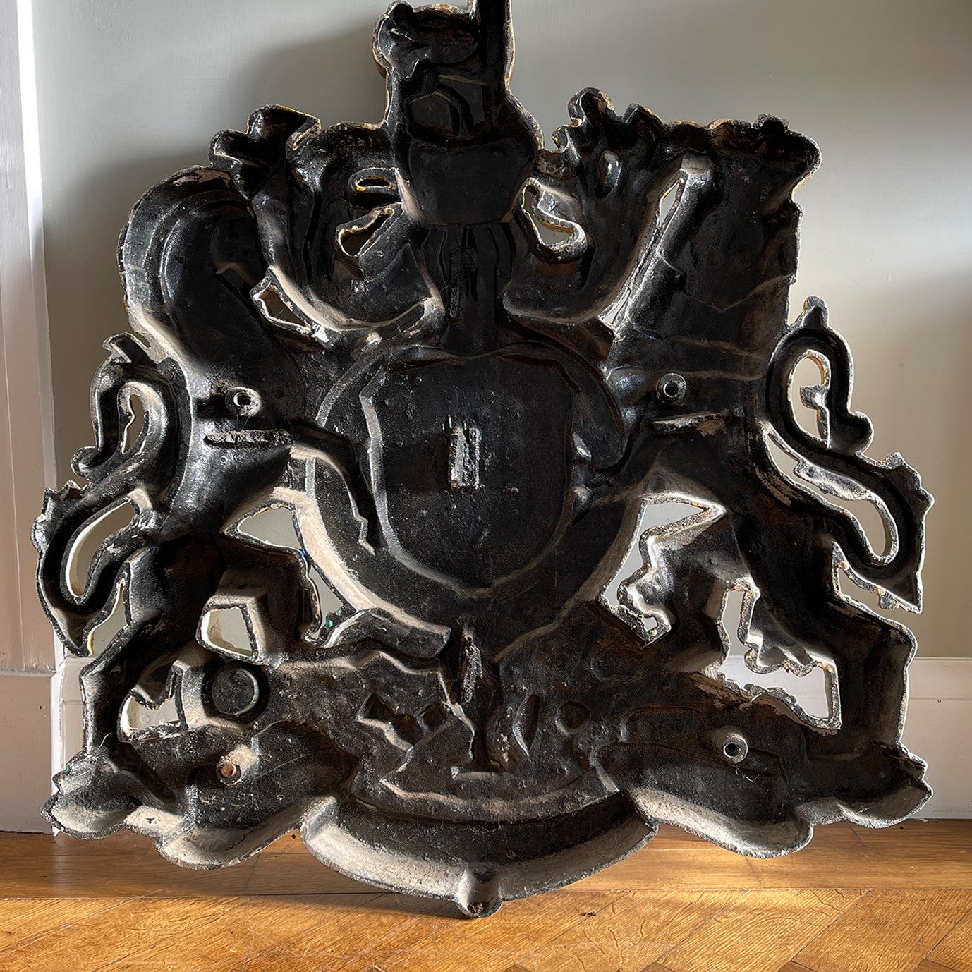 A magnificent, large cast Royal Coat of Arms centred by a crown with lion surmounted and flanked by the lion and unicorn supporting the shield. With foliate surrounded ribbon raised and carrying the motto of the monarch of the United Kingdom, 'Dieu et mon droit' meaning 'God and my right' - SHOP NOW - www.intovintage.co.uk