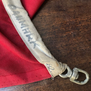 A Large Vintage Danish Flag. Marked 'Danmark' on the seem that also has a cast metal fastener. These flags look great framed and hung on the wall or, use it as a cool through or table cloth! - SHOP NOW - www.intovintage.co.uk