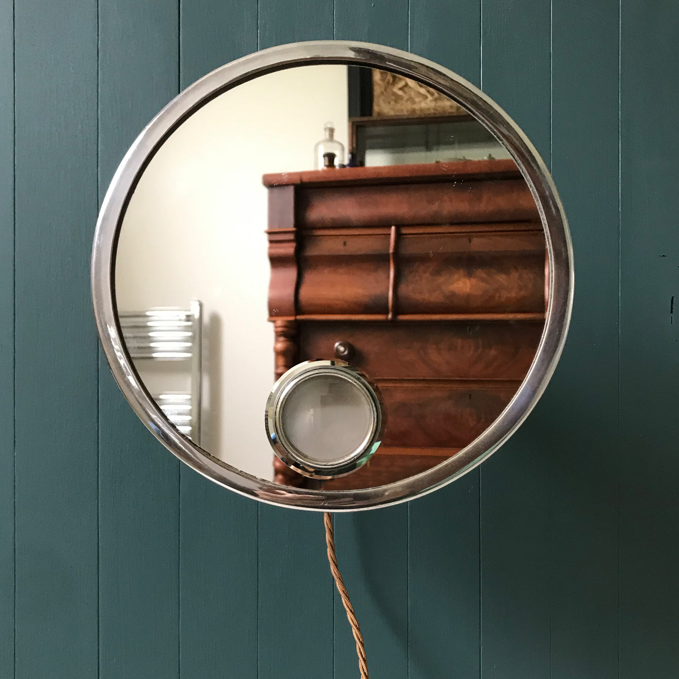 Art Deco Pivotal Shaving Mirror that lights from behind. The main frame and light lens have nickel plate frames. Behind the mirror face is a nickel plated pivotal arm, meaning you can position the mirror in many different ways - SHOP NOW - www.intovintage.co.uk