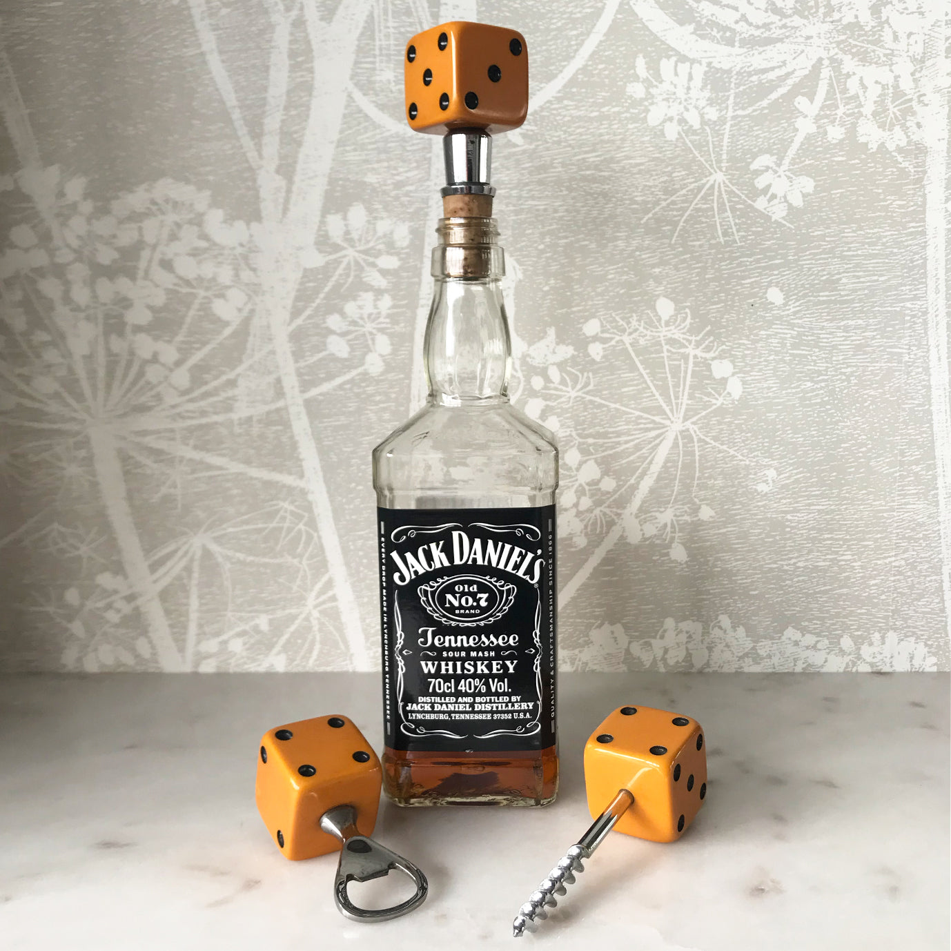 Three deep orange vintage dice all doing a job... One sits atop your bottle replacing the cork, pull off the dice and it becomes a pourer. The second dice is your corkscrew whilst the third dice opens your beer bottles - SHOP NOW - www.intovintage.co.uk