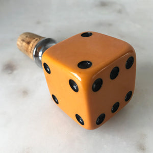 Three deep orange vintage dice all doing a job... One sits atop your bottle replacing the cork, pull off the dice and it becomes a pourer. The second dice is your corkscrew whilst the third dice opens your beer bottles - SHOP NOW - www.intovintage.co.uk
