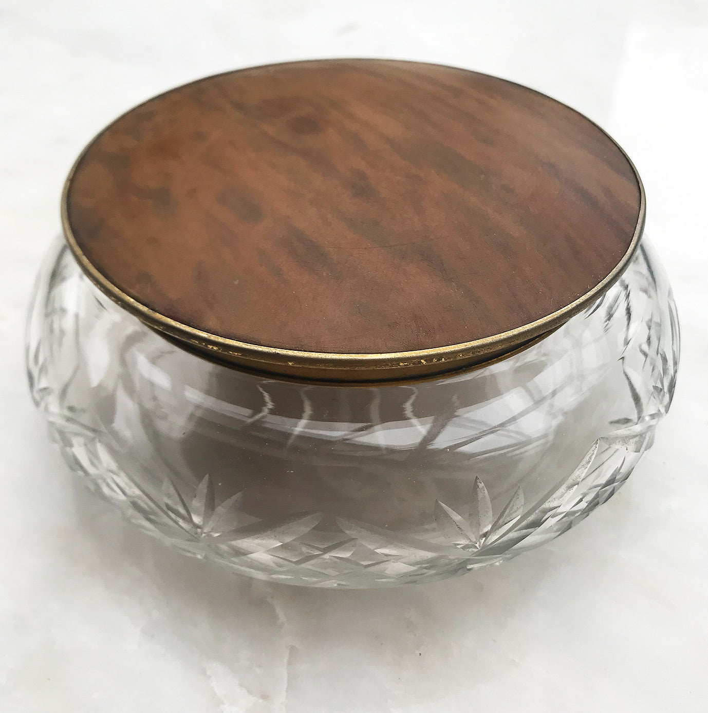 Good sized Cut Glass Edwardian Dressing Table Jar. With a brass rim inset with a wood effect lid that fits snuggly on to the glass. Ideal for the dressing table to keep your cotton wool pads in or some other treasure - SHOP NOW - www.intovintage.co.uk