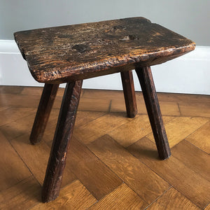 A very old Antique hand carved Elm Milking Stool with wonder colour and wear to the woods surface. Very solid and sitting on four tapered straight edged legs. The seat itself has a great depth to it with pegs and driven wedges. A beautiful piece -SHOP NOW - www.intovintage.co.uk
