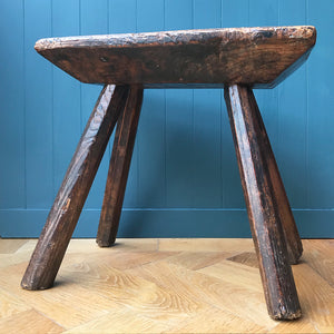 A very old Antique hand carved Elm Milking Stool with wonder colour and wear to the woods surface. Very solid and sitting on four tapered straight edged legs. The seat itself has a great depth to it with pegs and driven wedges. A beautiful piece -SHOP NOW - www.intovintage.co.uk