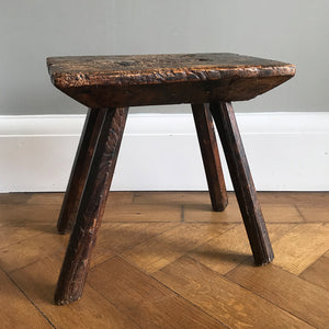 A very old Antique hand carved Elm Milking Stool with wonder colour and wear to the woods surface. Very solid and sitting on four tapered straight edged legs. The seat itself has a great depth to it with pegs and driven wedges. A beautiful piece -SHOP NOW - www.intovintage.co.uk