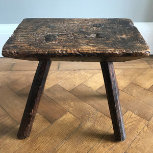 A very old Antique hand carved Elm Milking Stool with wonder colour and wear to the woods surface. Very solid and sitting on four tapered straight edged legs. The seat itself has a great depth to it with pegs and driven wedges. A beautiful piece -SHOP NOW - www.intovintage.co.uk