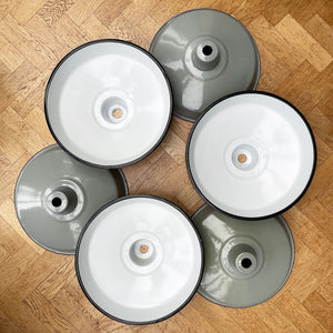 A run of six nice & clean smart grey enamel shades. The inner shade is finished in a white enamel. Great for for the kitchen. We have six of these lights available - SHOP NOW - www.intovintage.co.uk