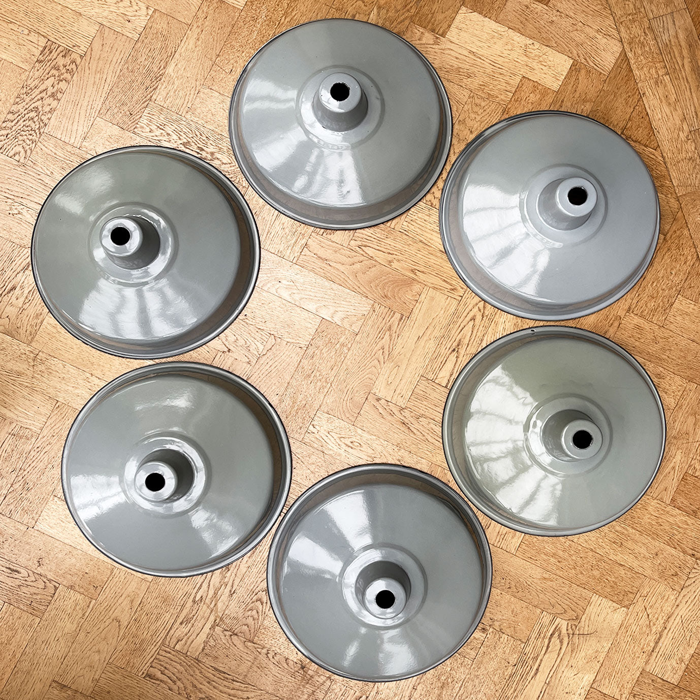 A run of six nice & clean smart grey enamel shades. The inner shade is finished in a white enamel. Great for for the kitchen. We have six of these lights available - SHOP NOW - www.intovintage.co.uk