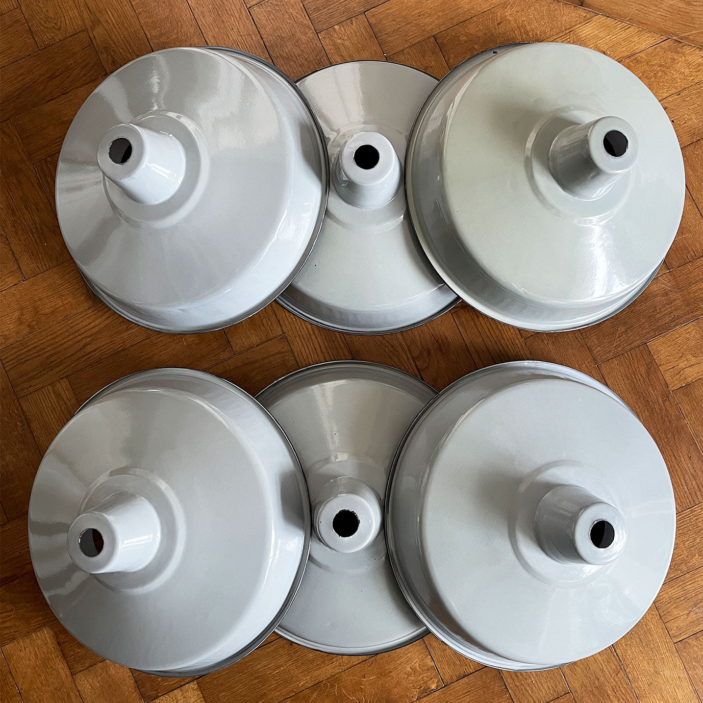 A run of six nice & clean smart grey enamel shades. The inner shade is finished in a white enamel. Great for for the kitchen. We have six of these lights available - SHOP NOW - www.intovintage.co.uk
