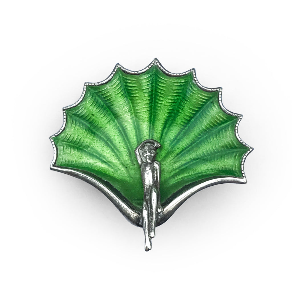 Beautiful and fresh enamelled silver pin. Reminiscent of Botticelli's 'Birth of Venus', a silver lady, her arm above her head, sits on a silver bow, in front of a stunning green enamelled shell. Marked 'Silver' - SHOP NOW - www.intovintage.co.uk