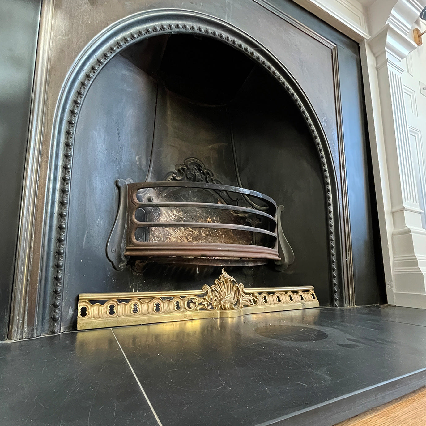 Victorian Gilded Cast Brass Fireplace Ash Keep with Its Rococo styling adding a touch of grandeur to any fireplace. It sits across the floor of the hearth below the basket stopping the ash spill out over the front of the fireplace. Good looking and practical too - SHOP NOW - www.intovintage.co.uk