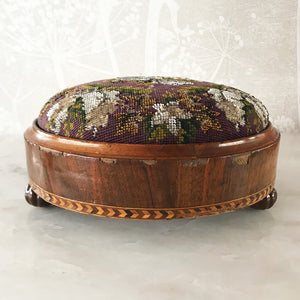 Pretty pair of Edwardian Foot Stools. Veneered mahogany bases with a chevron detail and ceramic feet. The tops are finished in a nicely coloured flower and leaf tapestry material with sewn in beadwork - SHOP NOW - www.intovintage.co.uk