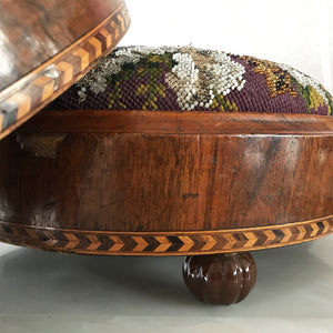 Pretty pair of Edwardian Foot Stools. Veneered mahogany bases with a chevron detail and ceramic feet. The tops are finished in a nicely coloured flower and leaf tapestry material with sewn in beadwork - SHOP NOW - www.intovintage.co.uk