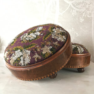 Pretty pair of Edwardian Foot Stools. Veneered mahogany bases with a chevron detail and ceramic feet. The tops are finished in a nicely coloured flower and leaf tapestry material with sewn in beadwork - SHOP NOW - www.intovintage.co.uk