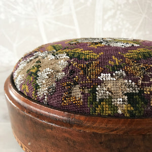 Pretty pair of Edwardian Foot Stools. Veneered mahogany bases with a chevron detail and ceramic feet. The tops are finished in a nicely coloured flower and leaf tapestry material with sewn in beadwork - SHOP NOW - www.intovintage.co.uk
