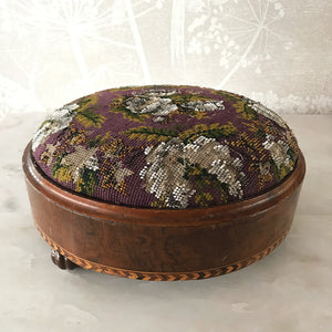 Pretty pair of Edwardian Foot Stools. Veneered mahogany bases with a chevron detail and ceramic feet. The tops are finished in a nicely coloured flower and leaf tapestry material with sewn in beadwork - SHOP NOW - www.intovintage.co.uk