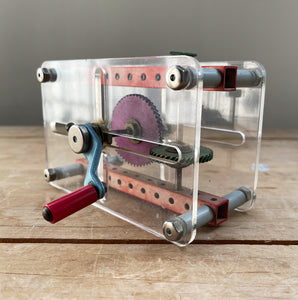 A Vintage Mechanical Teaching Aid that shows the mechanics of gears. Turning the little handle rotates a cog that in turn, turns another smaller cog which rotates a green arrow - SHOP NOW - www.intovintage.co.uk