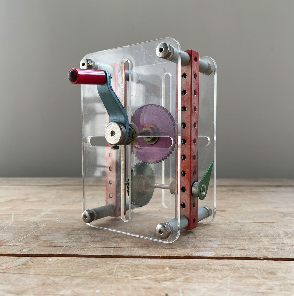 A Vintage Mechanical Teaching Aid that shows the mechanics of gears. Turning the little handle rotates a cog that in turn, turns another smaller cog which rotates a green arrow - SHOP NOW - www.intovintage.co.uk