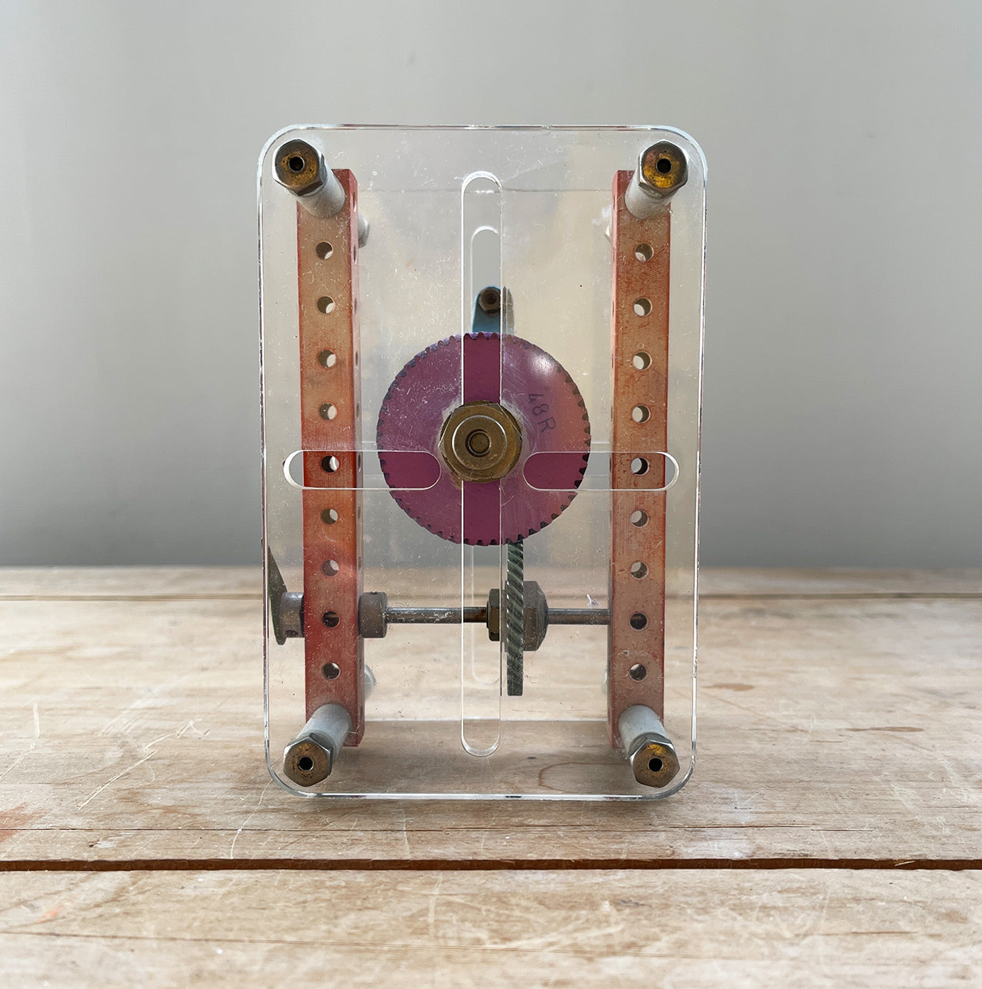 A Vintage Mechanical Teaching Aid that shows the mechanics of gears. Turning the little handle rotates a cog that in turn, turns another smaller cog which rotates a green arrow - SHOP NOW - www.intovintage.co.uk