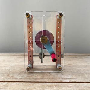 A Vintage Mechanical Teaching Aid that shows the mechanics of gears. Turning the little handle rotates a cog that in turn, turns another smaller cog which rotates a green arrow - SHOP NOW - www.intovintage.co.uk