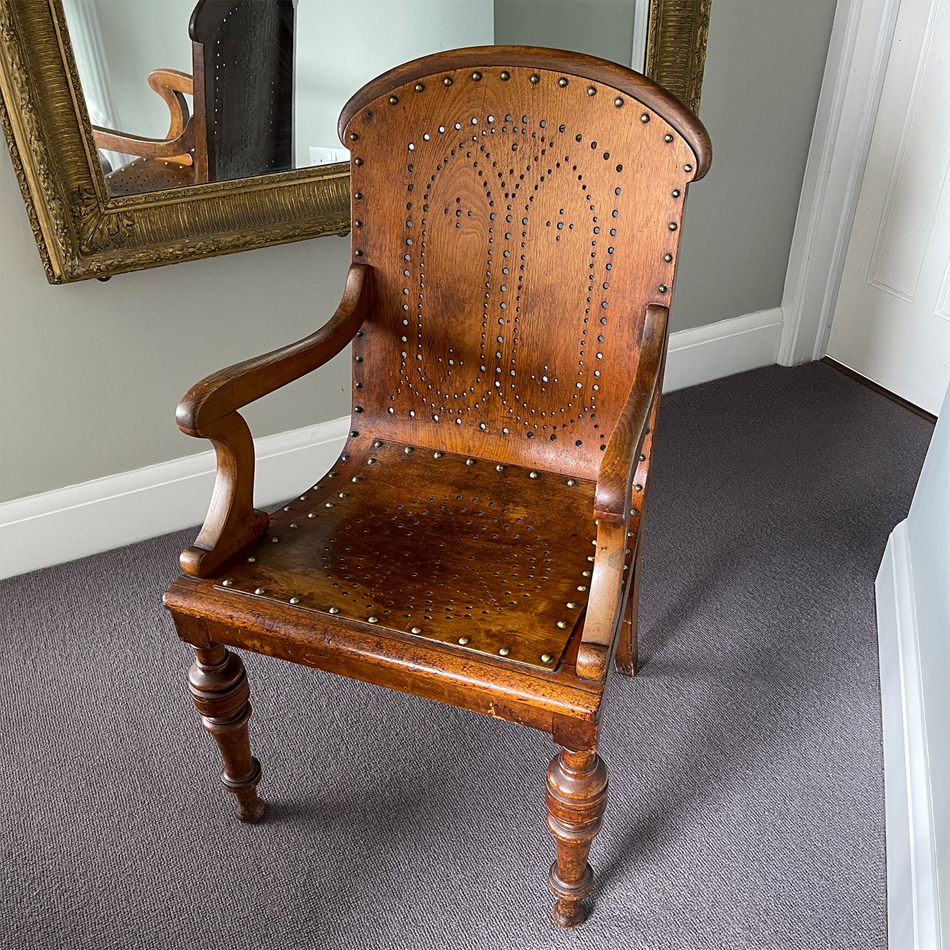 The sturdy Oak frame, raised on turned legs and arm supports with swept rear legs and curved Gothic inspired bent wood & drill pierced with brass studded backrest The seat has a drilled star motif to the seat and again is brass studded - SHOP NOW - www.intovintage.co.uk