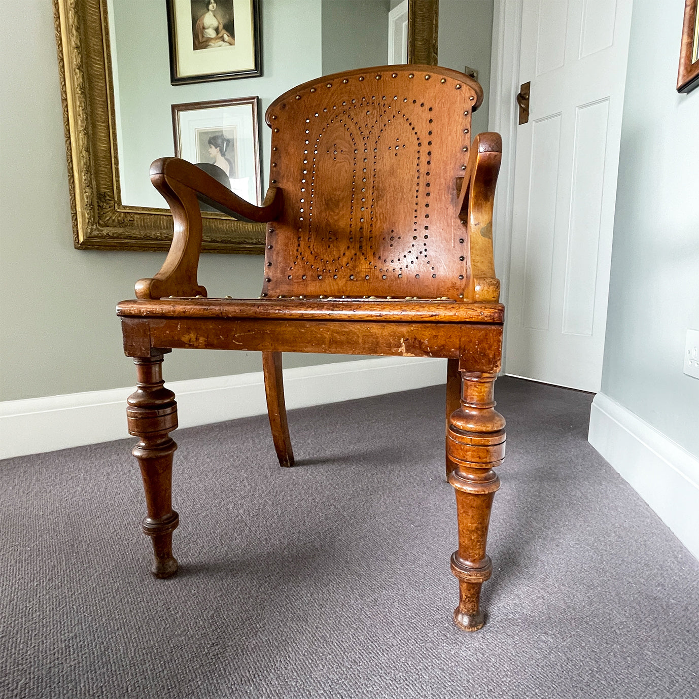 The sturdy Oak frame, raised on turned legs and arm supports with swept rear legs and curved Gothic inspired bent wood & drill pierced with brass studded backrest The seat has a drilled star motif to the seat and again is brass studded - SHOP NOW - www.intovintage.co.uk