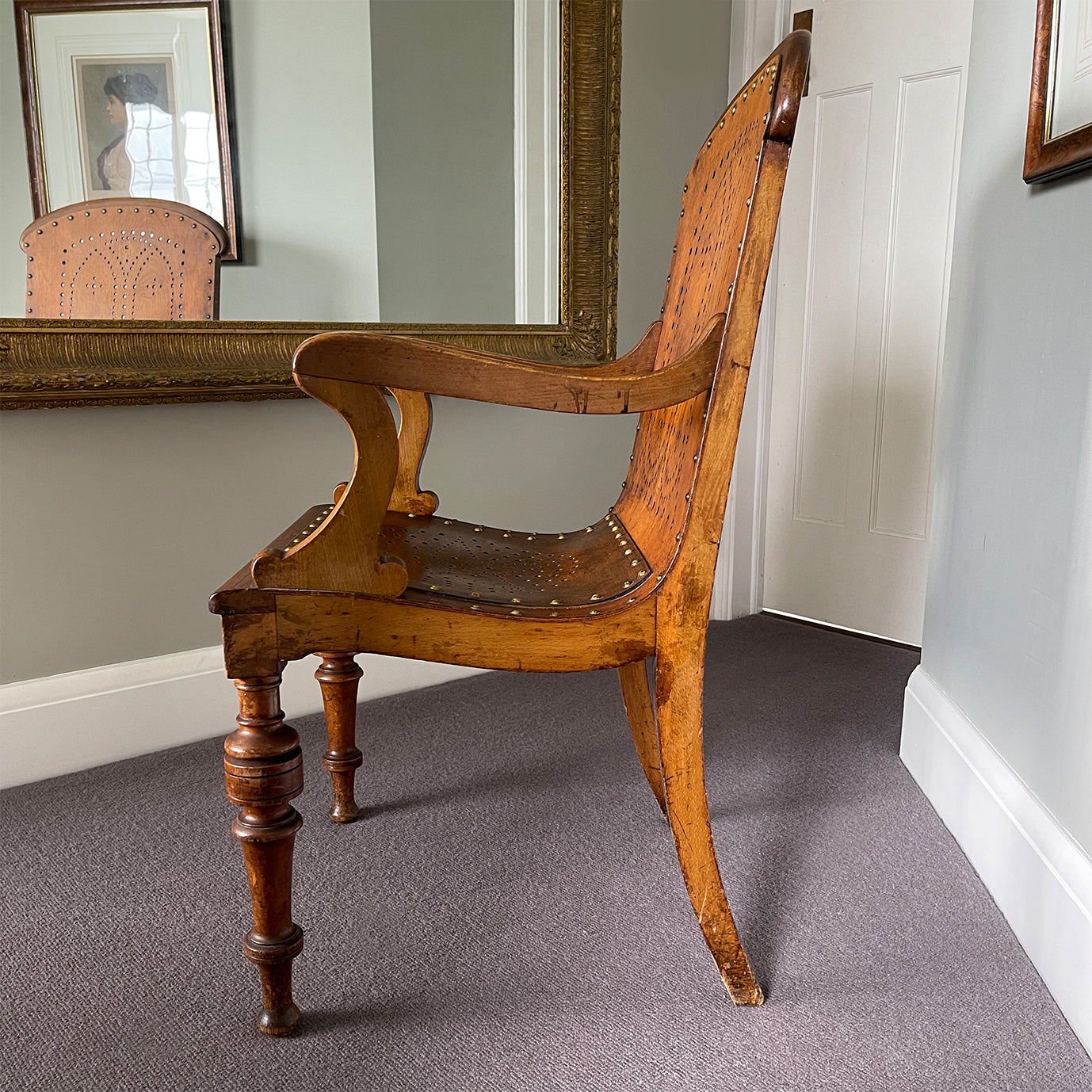 The sturdy Oak frame, raised on turned legs and arm supports with swept rear legs and curved Gothic inspired bent wood & drill pierced with brass studded backrest The seat has a drilled star motif to the seat and again is brass studded - SHOP NOW - www.intovintage.co.uk