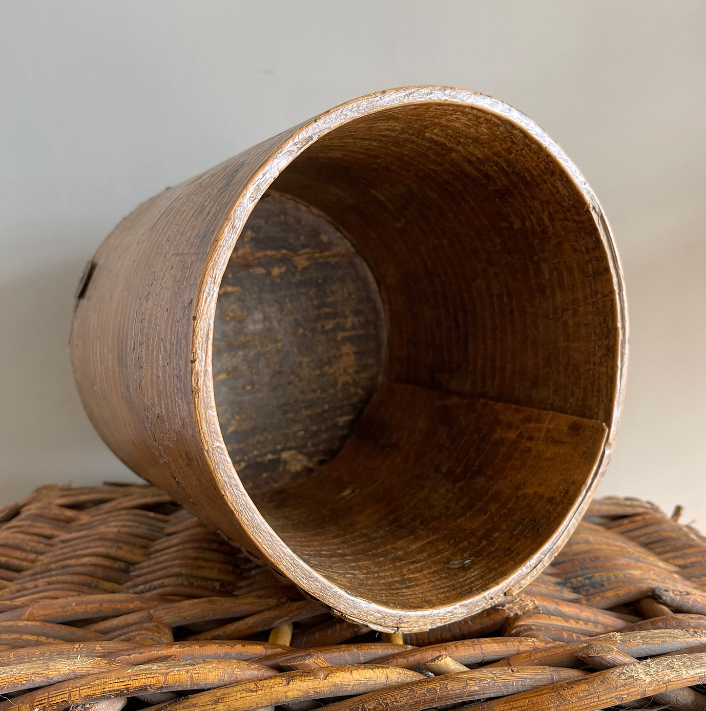 A Victorian Grain Measure. Constructed from yew wood with metal strapping. Marked with the Victorian Crown and the words 'Co LEICESTER' on the reverse