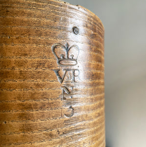 A Victorian Grain Measure. Constructed from yew wood with metal strapping. Marked with the Victorian Crown and the words 'Co LEICESTER' on the reverse