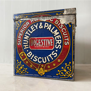 An Edwardian Huntley & Palmer’s large square Biscuit tin that would have been used in a shop to store biscuits for sale. Fantastic typography to the front with well preserved colourful print - SHOP NOW - www.intovintage.co.uk