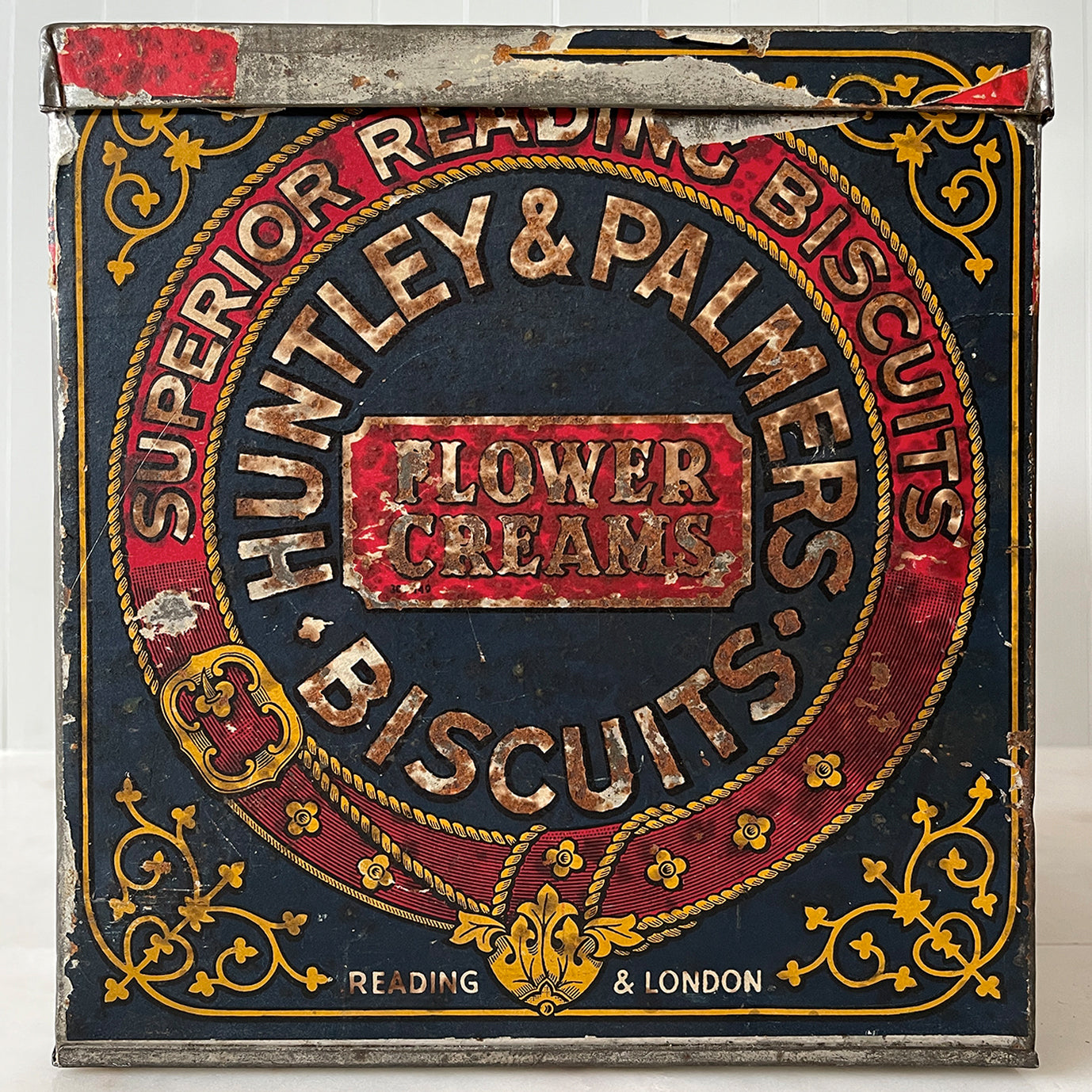 An Edwardian Huntley & Palmer’s large square Biscuit tin that would have been used in a shop to store biscuits for sale. Fantastic typography to the front with well preserved colourful print - SHOP NOW - www.intovintage.co.uk