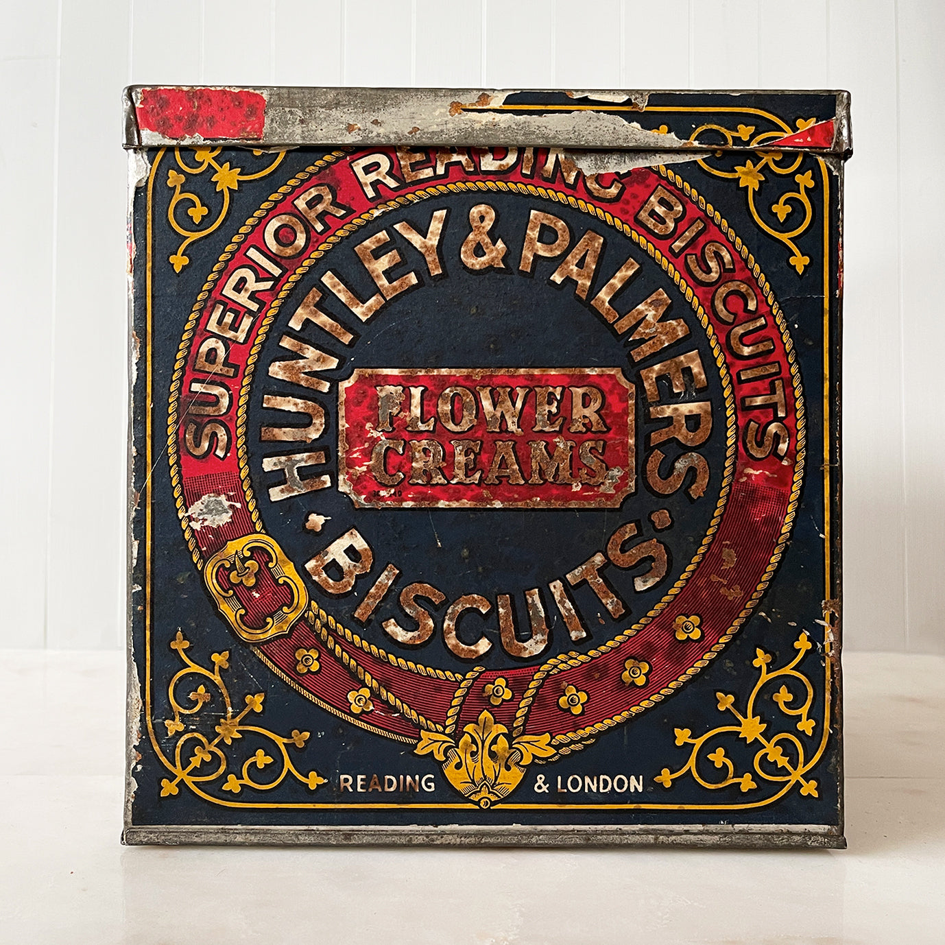An Edwardian Huntley & Palmer’s large square Biscuit tin that would have been used in a shop to store biscuits for sale. Fantastic typography to the front with well preserved colourful print - SHOP NOW - www.intovintage.co.uk