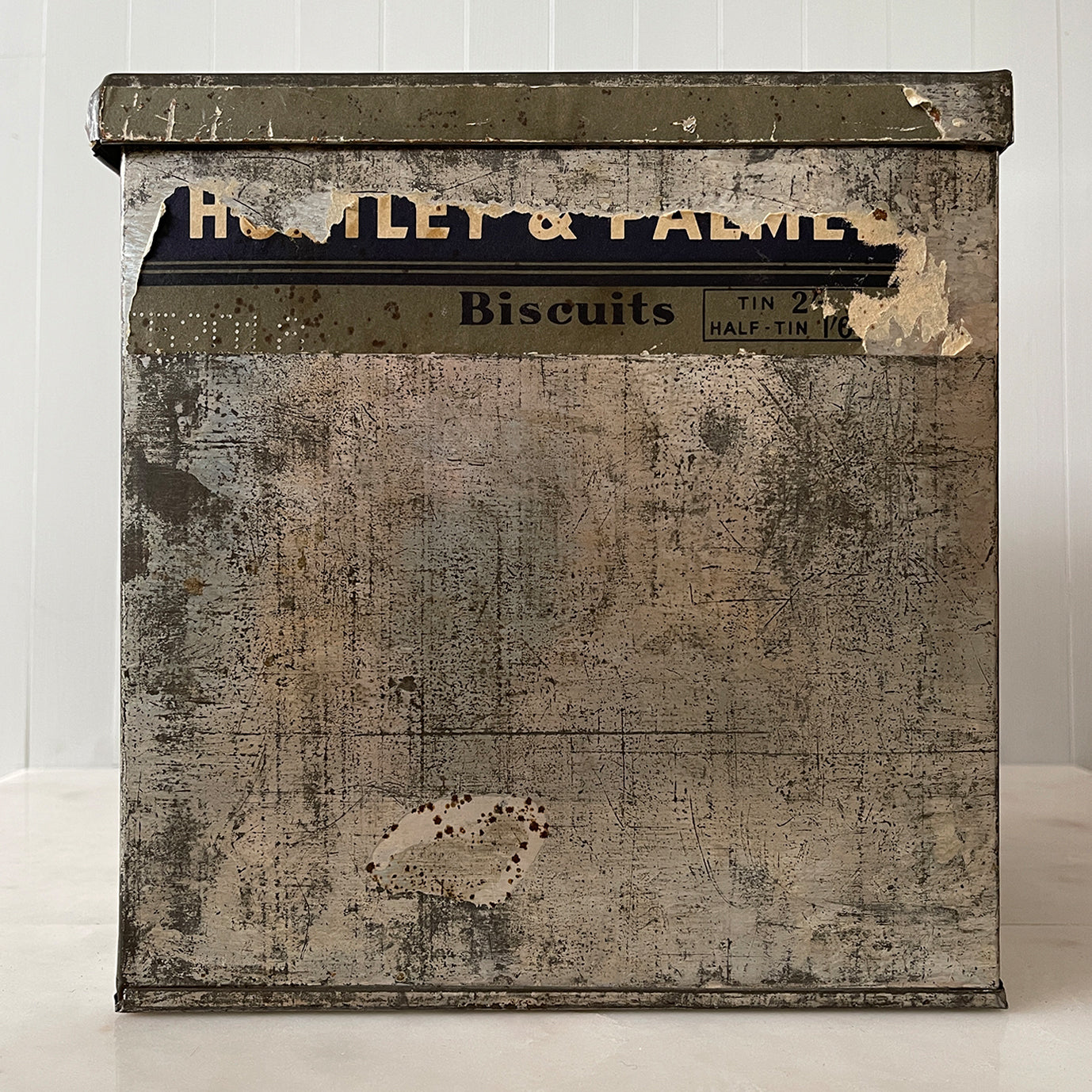 An Edwardian Huntley & Palmer’s large square Biscuit tin that would have been used in a shop to store biscuits for sale. Fantastic typography to the front with well preserved colourful print - SHOP NOW - www.intovintage.co.uk