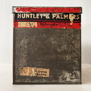 An Edwardian Huntley & Palmer’s large square Biscuit tin that would have been used in a shop to store biscuits for sale. Fantastic typography to the front with well preserved colourful print - SHOP NOW - www.intovintage.co.uk