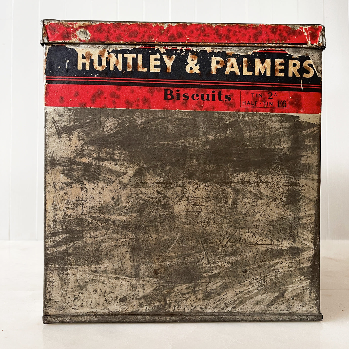 An Edwardian Huntley & Palmer’s large square Biscuit tin that would have been used in a shop to store biscuits for sale. Fantastic typography to the front with well preserved colourful print - SHOP NOW - www.intovintage.co.uk