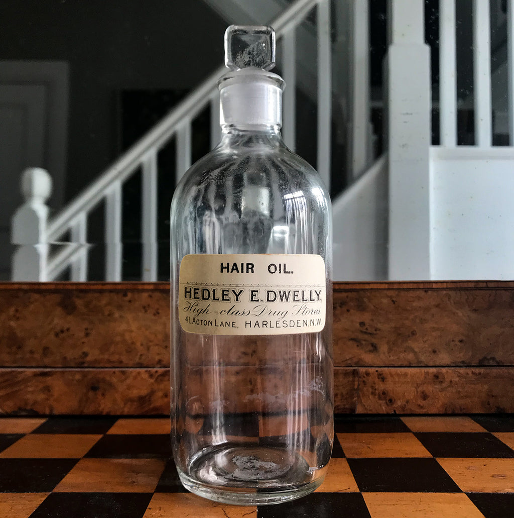 Vintage Clear Apothecary Bottle with an original paper label from Hedley E. Dwelly, High-Class Drug Stores, 41, Acton Lane, Harlesden. N.W. - SHOP NOW - www.intovintage.co.uk