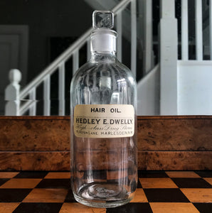 Vintage Clear Apothecary Bottle with an original paper label from Hedley E. Dwelly, High-Class Drug Stores, 41, Acton Lane, Harlesden. N.W. - SHOP NOW - www.intovintage.co.uk