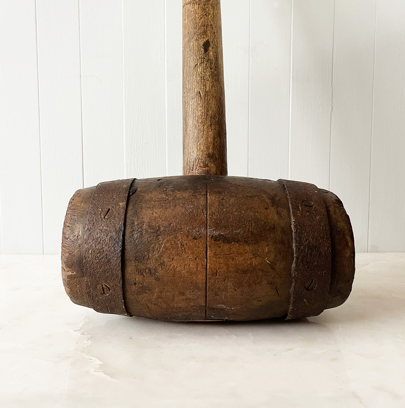 A Large Antique Mallet. It has two metal riveted straps at each end with a sturdy hickory handle. With fantastic age and wear to it, this mallet would have been used in either a circus or fairground to whack the tent spikes in - SHOP NOW - www.intovintage.co.uk