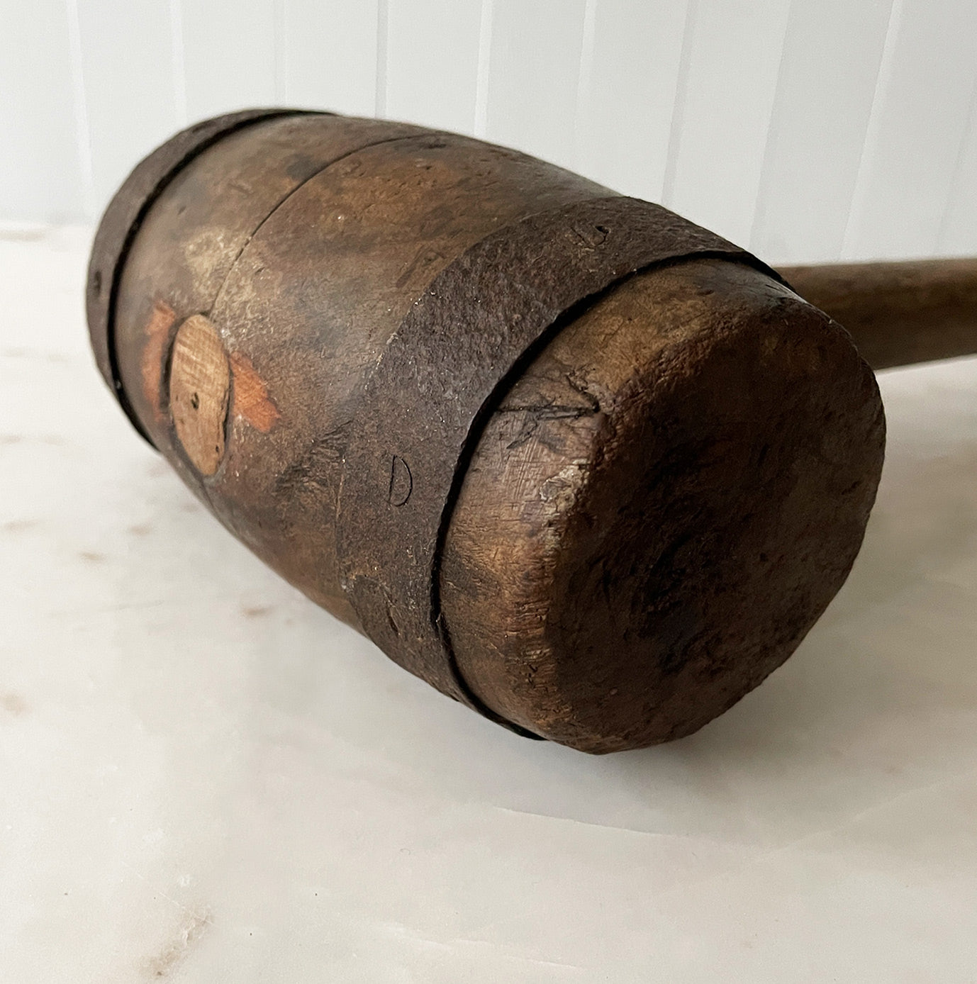 A Large Antique Mallet. It has two metal riveted straps at each end with a sturdy hickory handle. With fantastic age and wear to it, this mallet would have been used in either a circus or fairground to whack the tent spikes in - SHOP NOW - www.intovintage.co.uk
