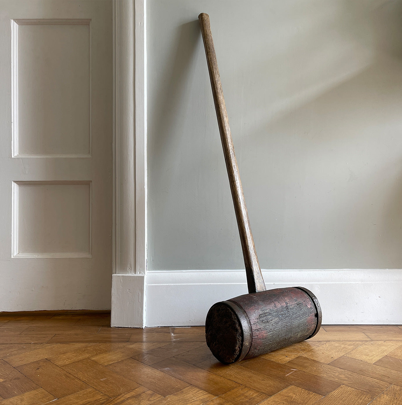 A Large Antique Circus/Fairground Hammer with remnants of its original red paint. It has two metal riveted straps at each end with a sturdy hickory handle - SHOP NOW - www.itovintage.co.uk